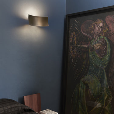 Oluce Lens wall lamp in anodic bronze, studio shot