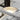 Compact Duelle wall sconce, 5 inch height, warm LED, for small spaces.