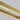 Close-up of natural brass finish on Stagger 84 linear suspension lighting.