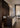 Ilo horizontal pendant above a dark reception counter in a showroom