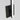 17 inch Kenway designer wall light fixture, installed vertically, showing warm LED glow, matte black finish