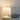 Portable LED table lamp with ivory ceramic body and black accents