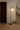 Designer NH floor lamp by Artemide featuring black metal pole and round glass shade for hotel reception areas
