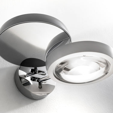 Nautilus Wall Sconce by Lodes with dim-to-warm LED, chrome finish, ideal for bedrooms, living rooms, and office interiors