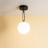 Modern NH 22 ceiling light with glass globe and brass ring by Artemide for bedroom or office lighting
