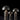 Three satin bronze Atollo table lamps by Oluce in small, medium and large sizes, studio view