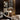 Satin bronze Atollo table lamp by Oluce lit in a dressing room