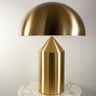 Gold Atollo table lamp by Oluce, studio close-up