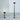 Oluce Fresnel outdoor floor lamps in small and large heights, studio view