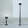 Oluce Fresnel outdoor floor lamps in small and large heights, studio view