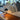 Oluce Medusa table lamp beside a sofa in a living room