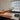 Pair of Spider lamps on a long desk in a bright office