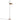 Oluce Spider floor lamp in mustard yellow with adjustable reflector on a chrome stem