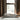 Oluce Superluna floor lamp behind a sofa in a bright living room