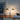 Oluce Dora table lamp on a side table, lifestyle view