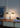Oluce Dora table lamp on a side table, lifestyle view