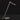 Oluce Calamaio satin black nickel desk lamp with angled arm, studio view on a dark background