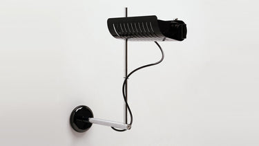 Oluce Colombo wall lamp in black with a chrome arm and ribbed reflector on a white studio background