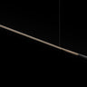 Oluce Ilo horizontal pendant, a long slim satin bronze LED bar with matt black terminal, studio shot