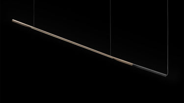 Oluce Ilo horizontal pendant, a long slim satin bronze LED bar with matt black terminal, studio shot