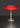 Oluce Dora table lamp in satin gold with red glass shade