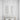 Visual Comfort natural brass vertical light fixture in upscale commercial lounge