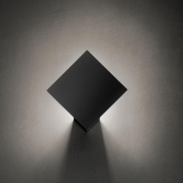 Puzzle Single Square LED wall light by Lodes in matte white with backlit glow