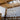 ET2 Quartz crystal pendant cluster seen against wood beams and a skylight in a vaulted living room