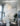 ET2 Quartz crystal pendants cascading down a stairwell above a glass dining table