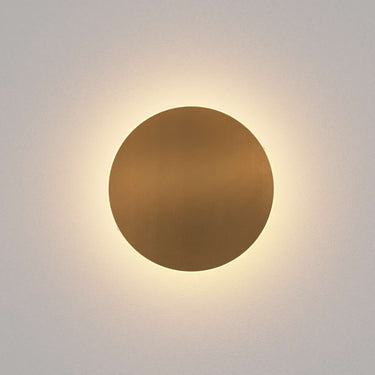 Ramen round LED wall sconce with brass finish, perfect for modern living room decor.