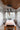Cluster of Roest iron pendants hanging over a dining table, Graypants lifestyle photo