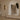Two Contour wall lights either side of an arched opening in a living room