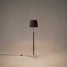 Santa & Cole Pie de Salón G3 floor lamp with Black Ribbon shade and chrome finish in a modern living room