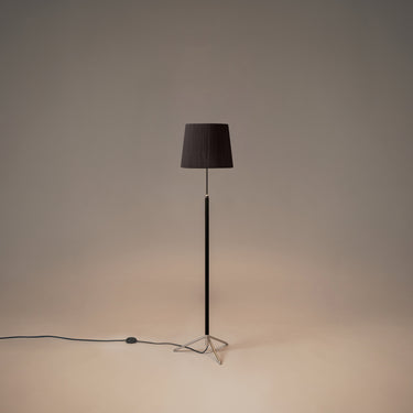 Santa & Cole Pie de Salón G3 floor lamp with Black Ribbon shade and chrome finish in a modern living room