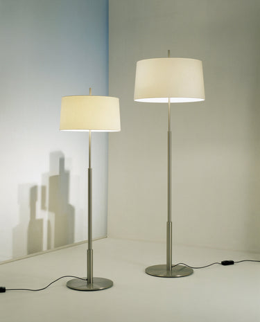 Santa & Cole Diana floor lamp illuminating a sophisticated lounge