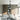 ET2 Serpentine looping black and white semi-flush mount hung over a coffee table and gray sofa in a living room with wood cabinets