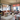 Visual Comfort Spectica chandelier with hanging stem and slope ceiling mount, living room setting
