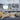 ET2 Sven glass dome pendant over a kitchen island beside a living area