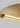 Natural Brass Bau 50 linear pendant light with integrated LED lighting, providing a soft, ambient glow.