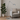 Tolomeo adjustable floor lamp beside modern beige armchair with plant, Italian LED lighting for living room