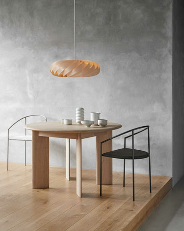 Natural Birch, lit over a dining table | TR5 Pendant by Tom Rossau