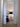 Modern Tripode G5 floor lamp with black ribbon shade and warm lighting