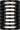 Quoddy 9 Outdoor Wall Light by Sean Lavin in Outdoor Black, lit straight-on view of the louvered cylinder
