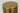 Detail of the Natural Brass top disc of the Quoddy Small table lamp with its small center mark
