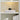 Close view of the Caspe 6 lamp lit on a shelf, resting on two large books