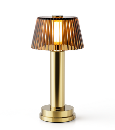 Victoria cordless table lamp with amber glass shade, rechargeable ambient light for patio dining.