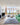 Adjustable monopoint ceiling light for modern living room decor.
