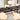 Linear suspension chandelier with opal globes and brass finish, suitable for homes and commercial settings