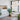 White Moon cluster of five globes hanging above a dining table in a bright loft with large windows and plants