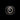 Front view of the Oluce Yolk wall lamp with a glowing opal center ring on a dark background